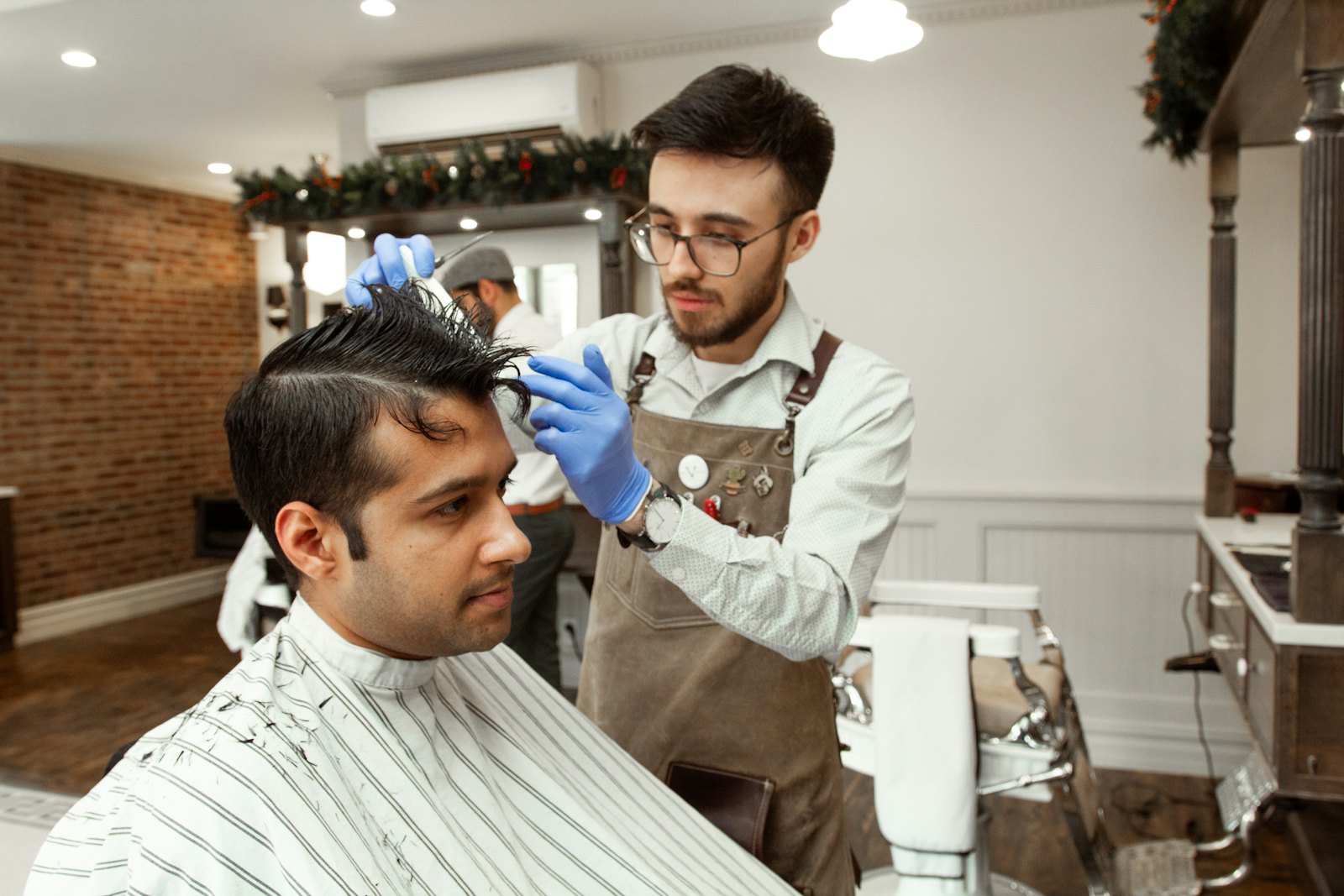 Barber cutting a client's hair