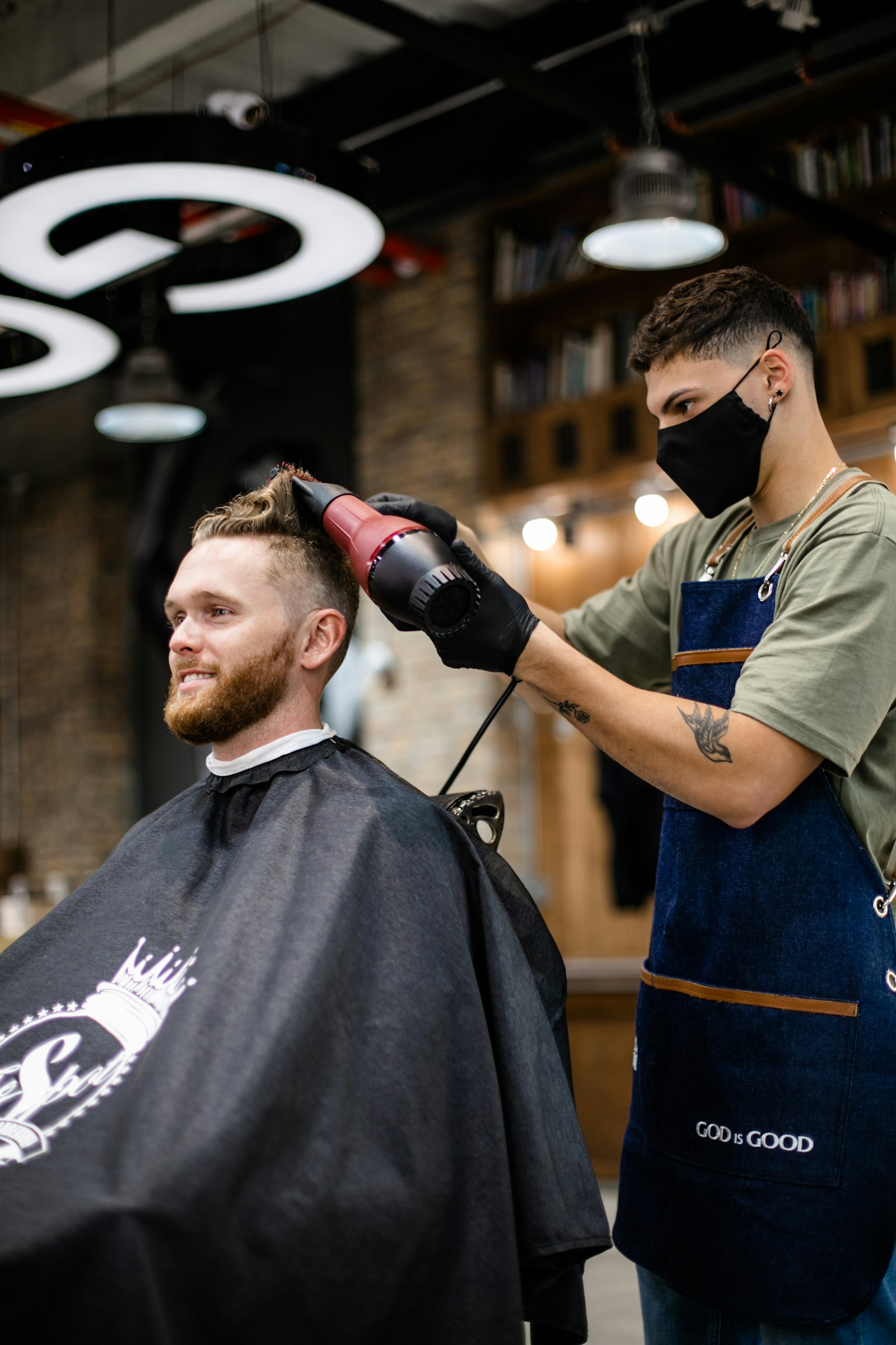 Barber finishing a haircut