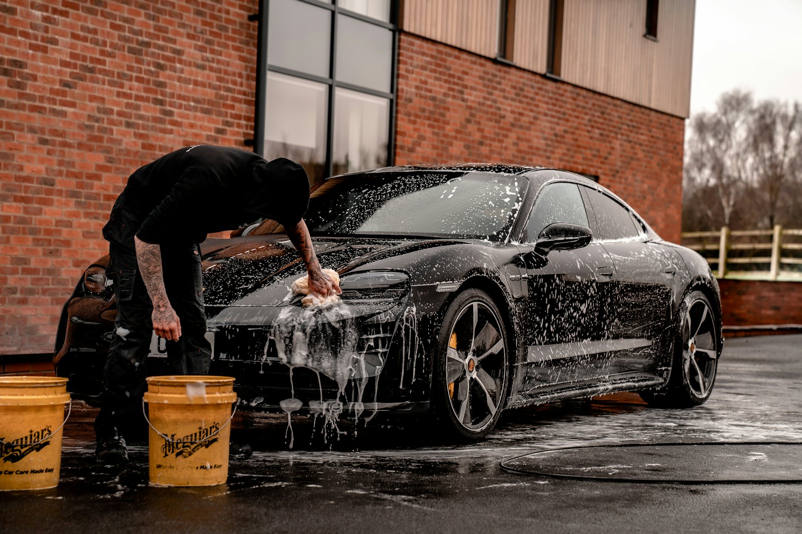 Car being hand washed with foam