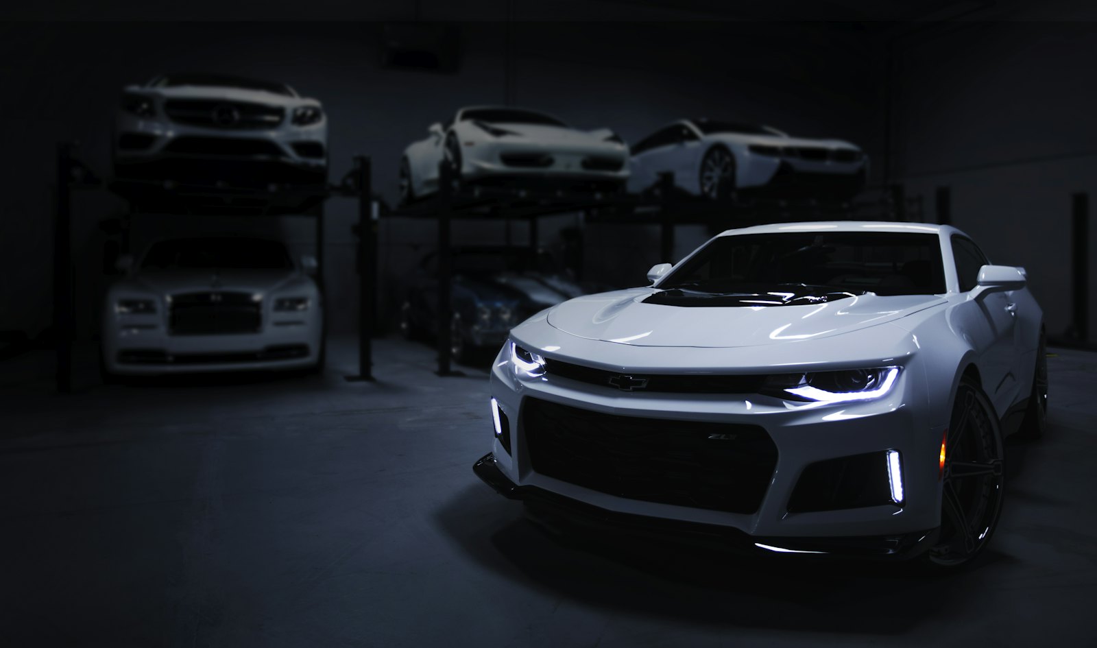 Grey sports car in a dark garage