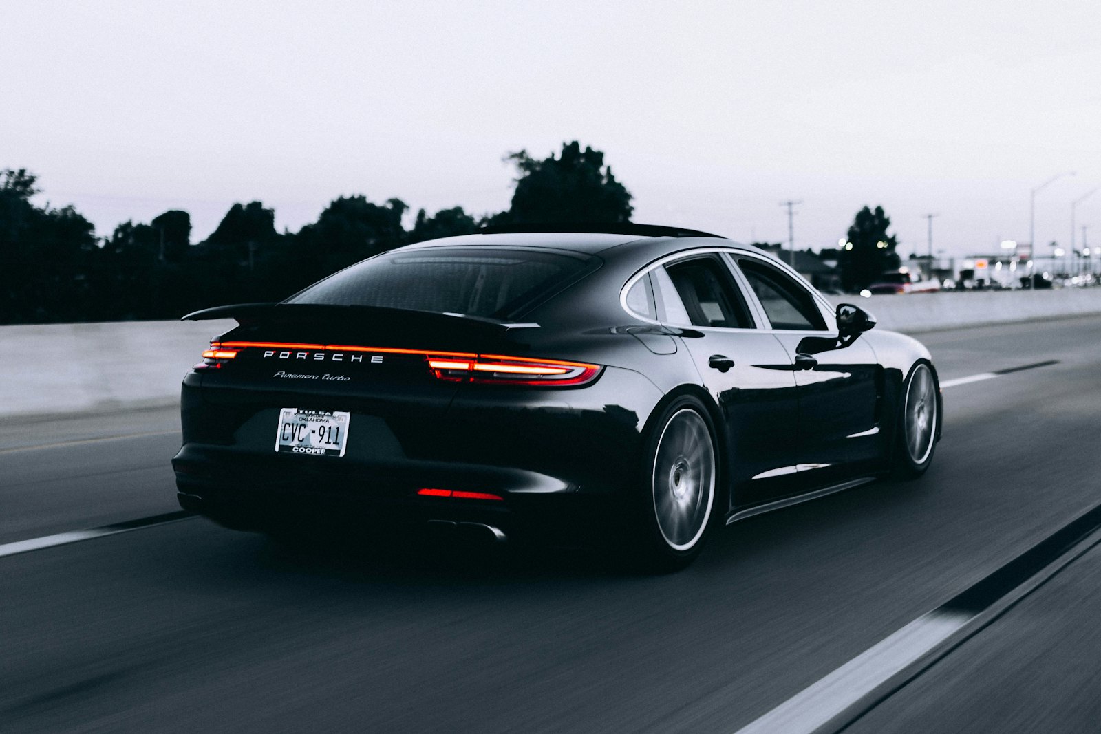 Black sports car on a road