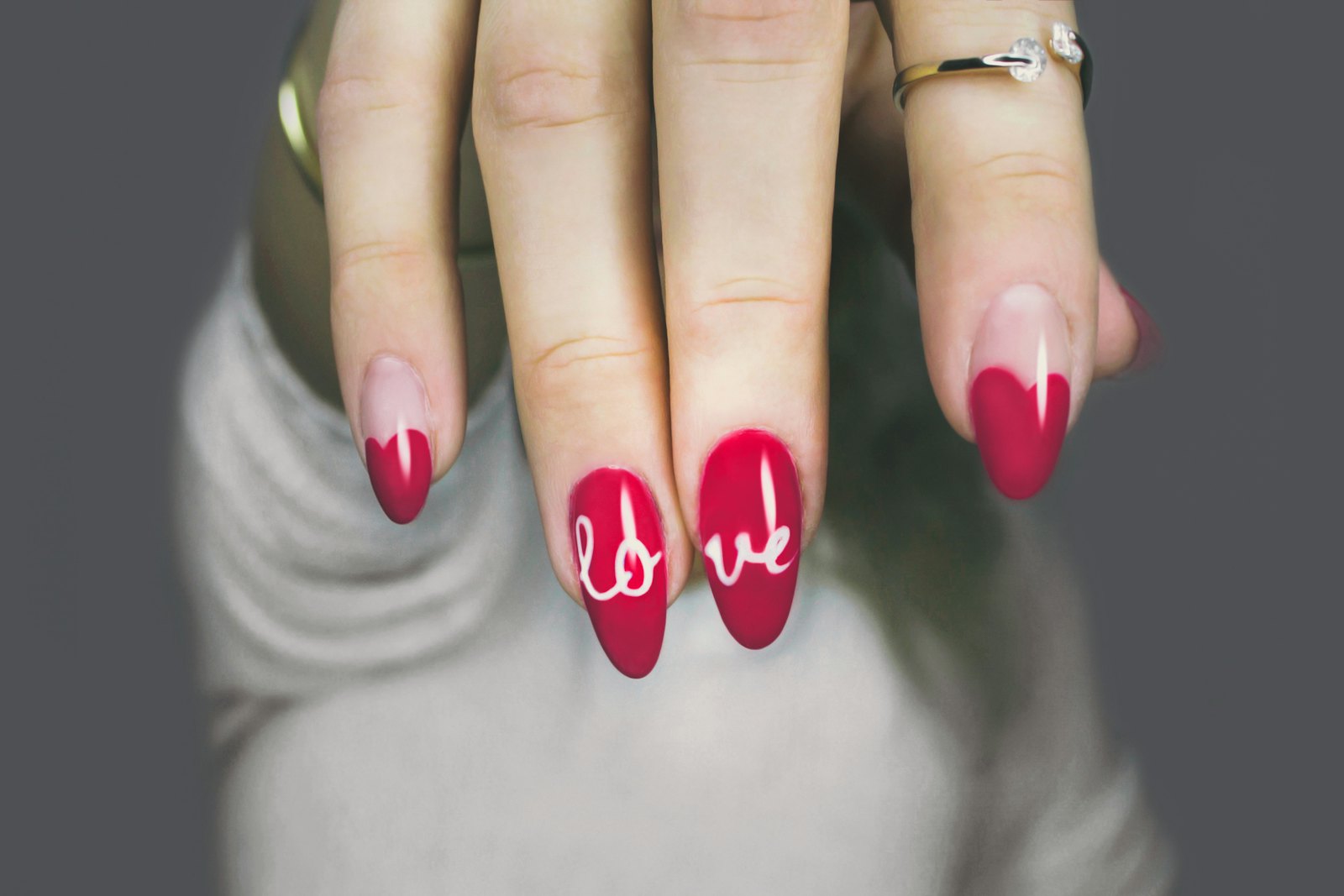 Red nails with heart design