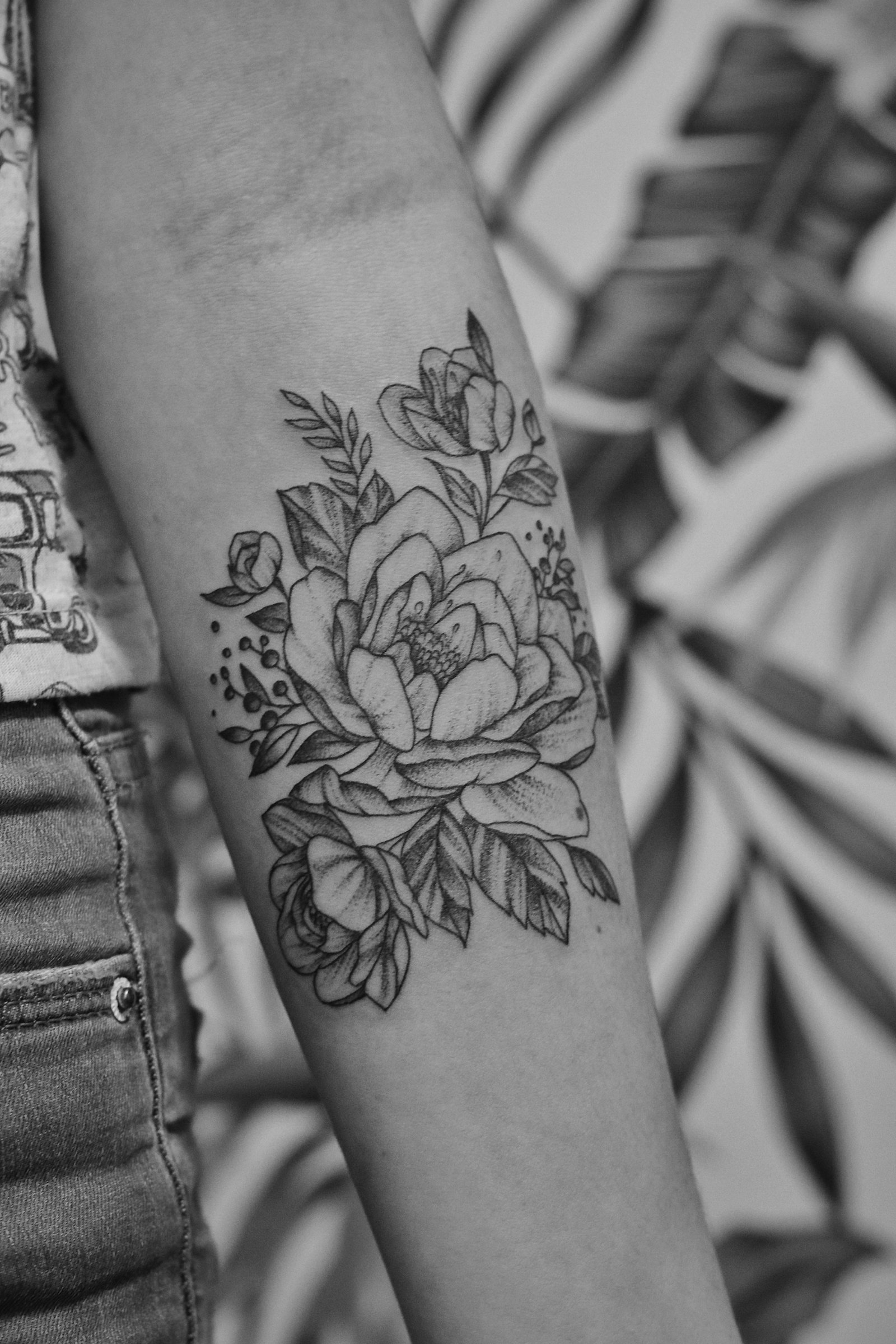 Black and grey floral tattoo