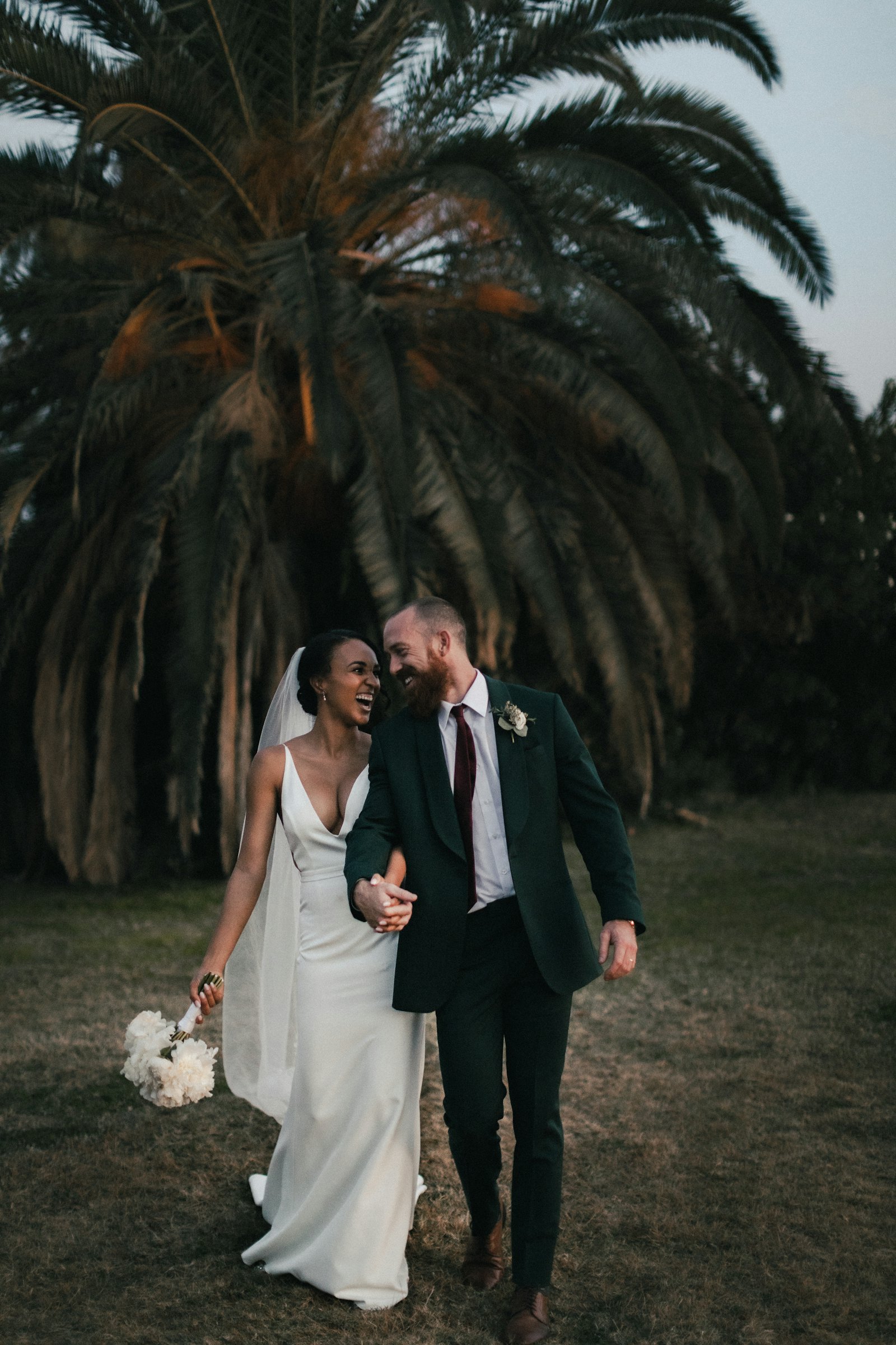 Bride and groom laughing together