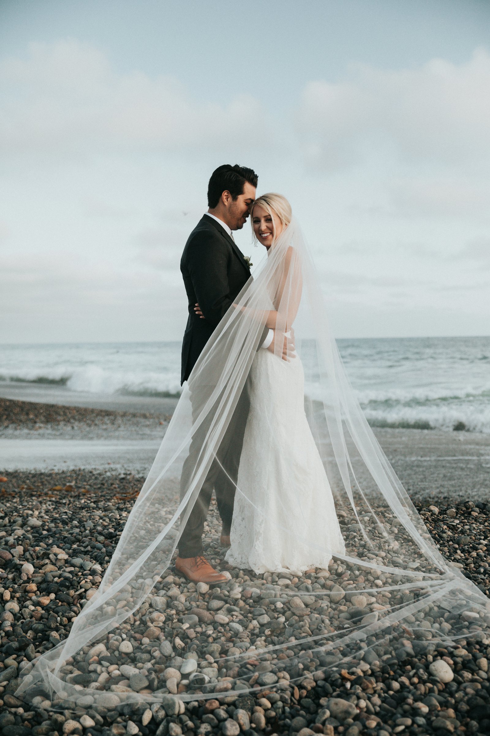 Couple on a beach in wedding clothes